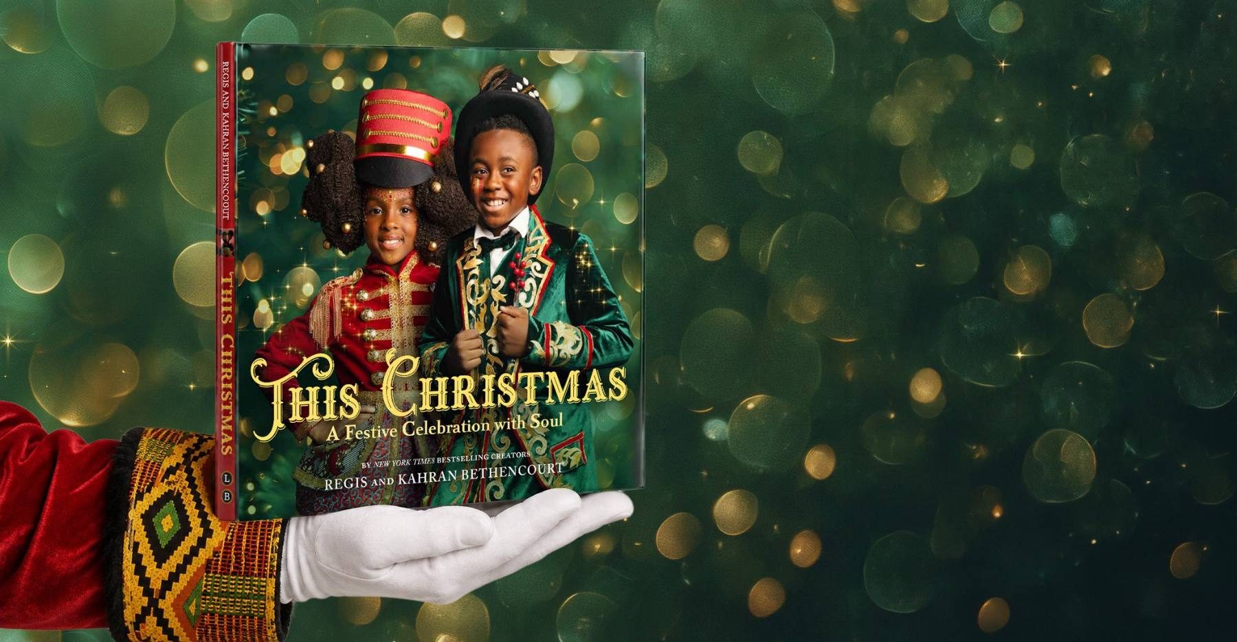 The This Christmas hardcover held in a white-gloved hand against green and gold bokeh