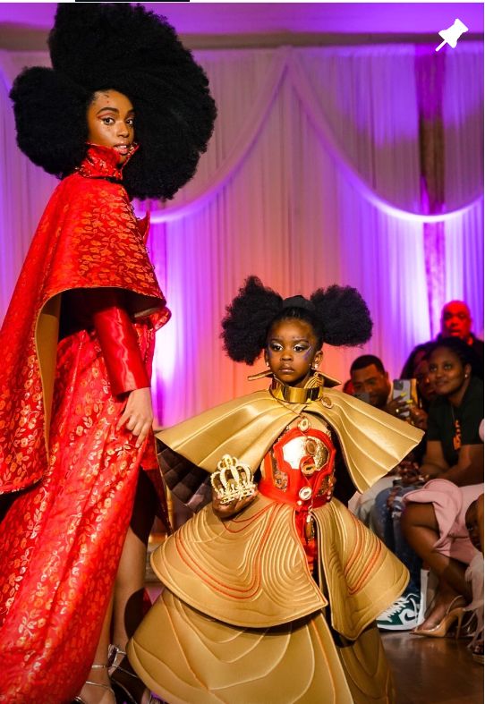 Runway walk with full afros in red and gold couture