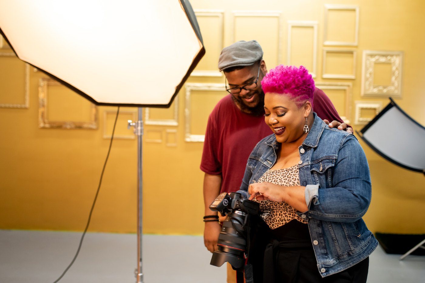Photographer Resources category, Kahran and Regis reviewing shots on set
