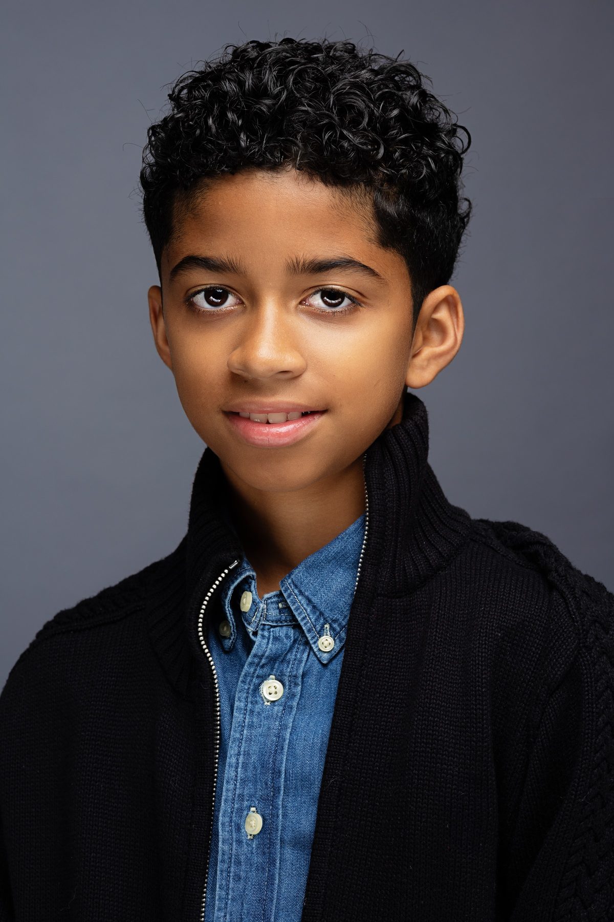 Boy in a navy blazer and blue shirt