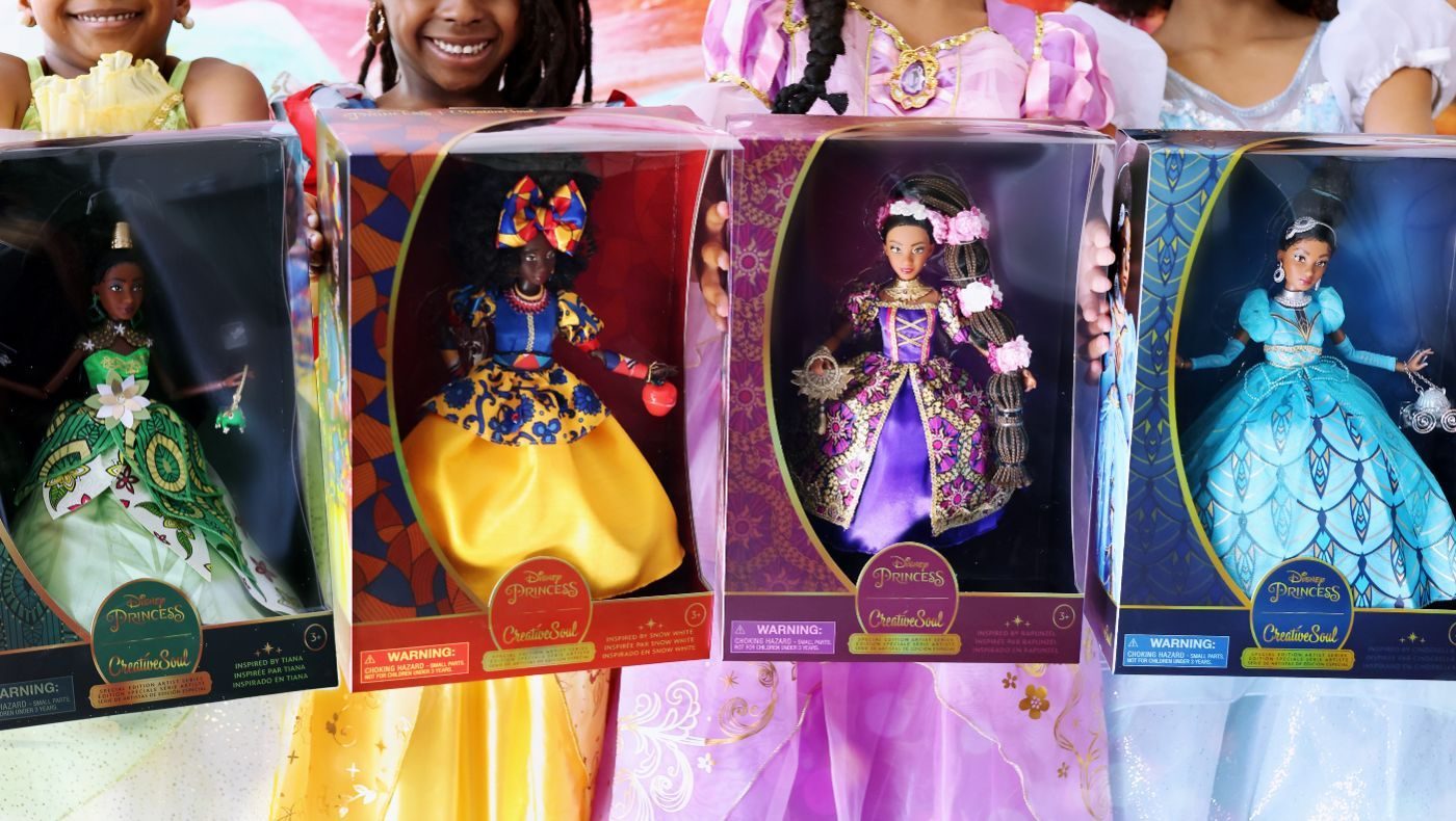 Children holding the CreativeSoul x Disney Princess special edition dolls