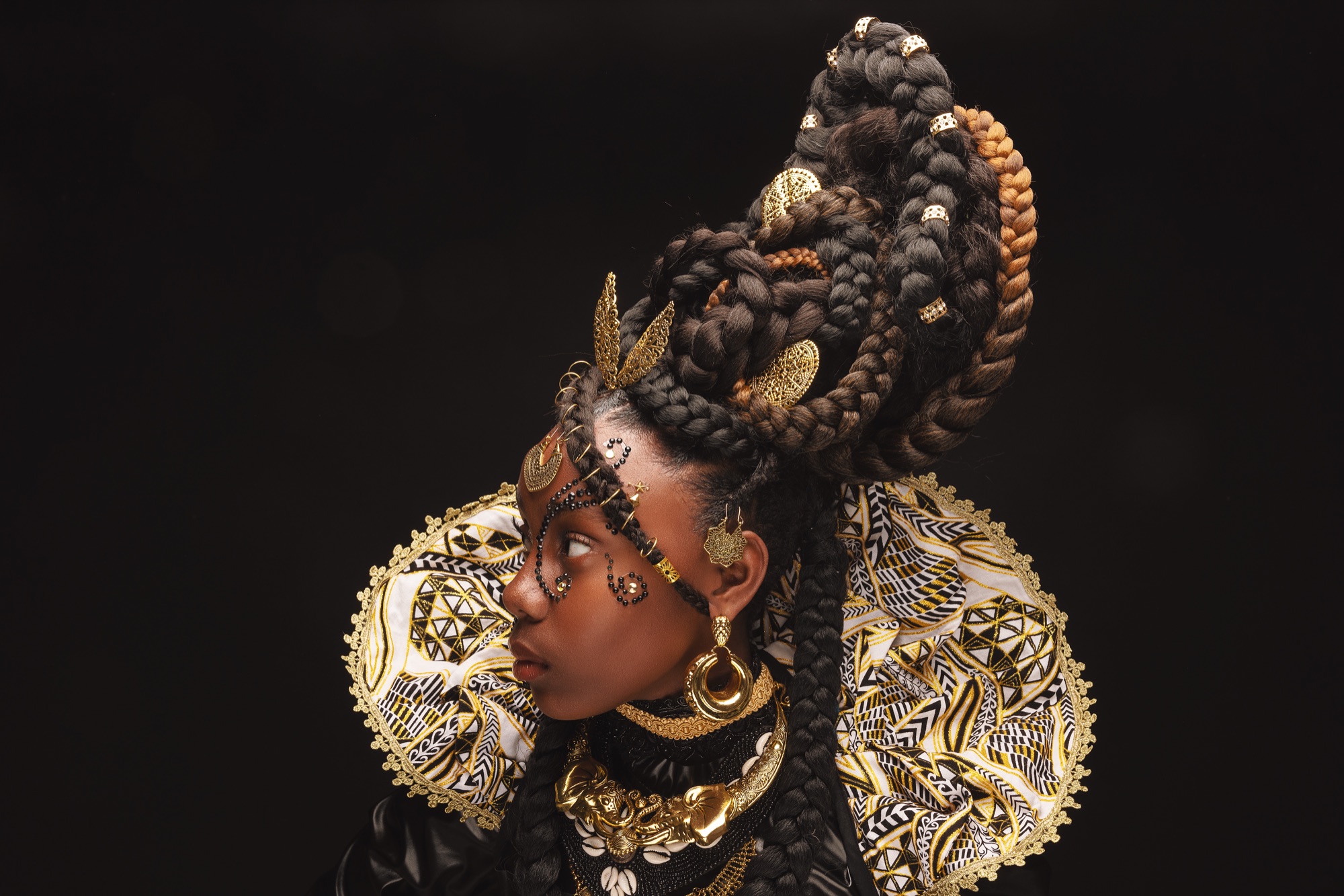 Child in a gold-styled braided updo with jewelled adornments, portrait by CreativeSoul Photography