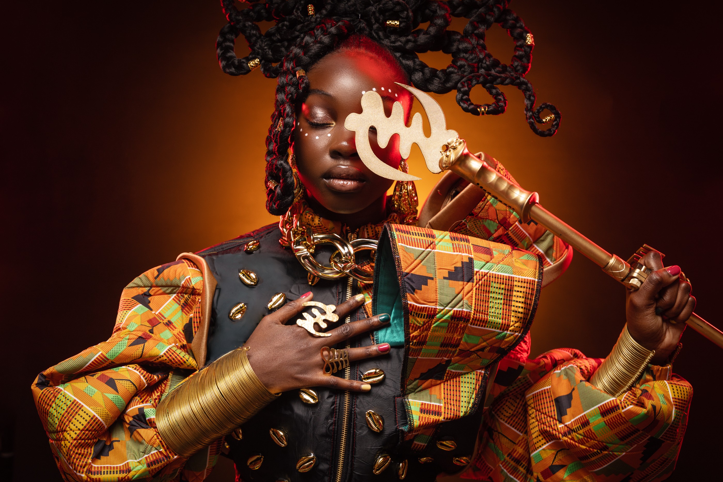 Girl in a neon braided wig and ruffles against a striped colour wall